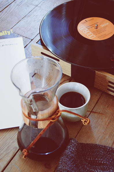 Chemex with a record and coffee cup